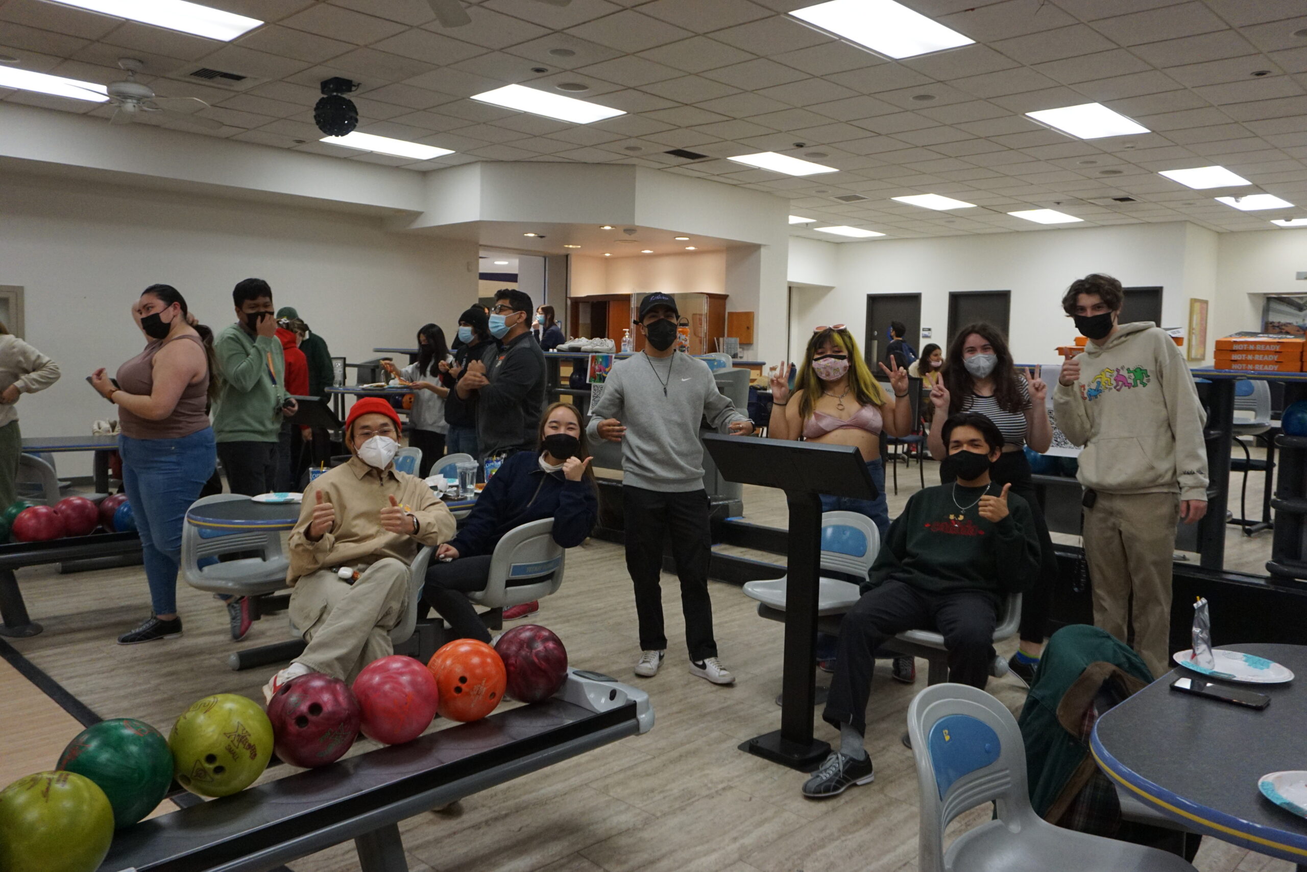 picture of many people at the bowling alley